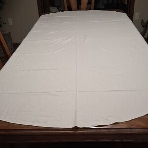 99" X 57" oval white linen tablecloth.
